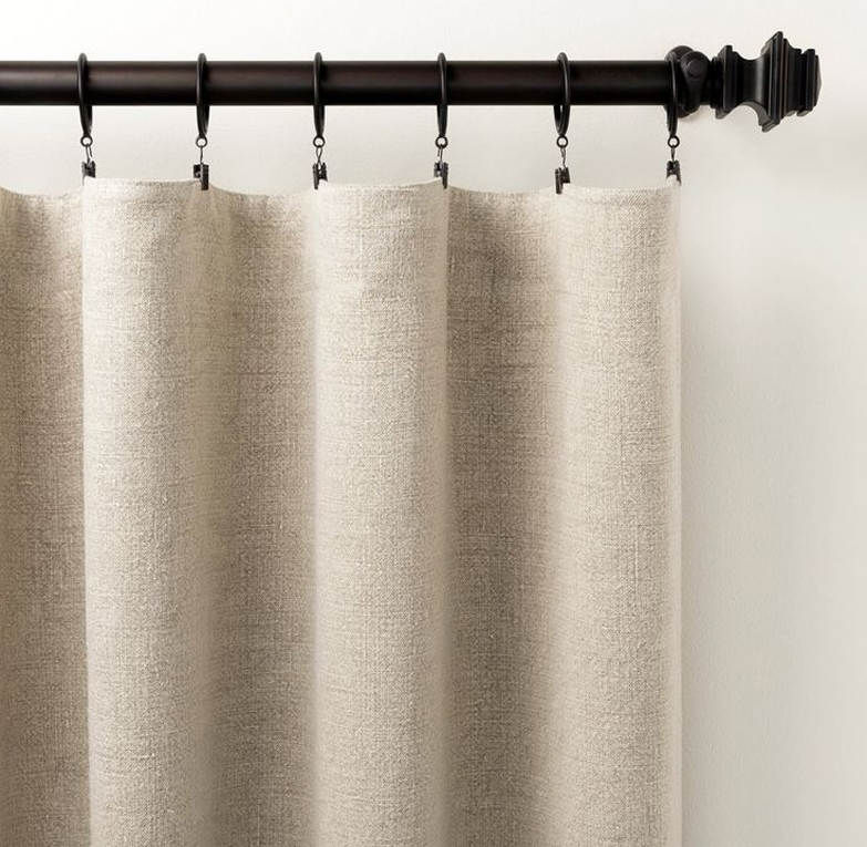 Neutral linen drapery on decorative rod