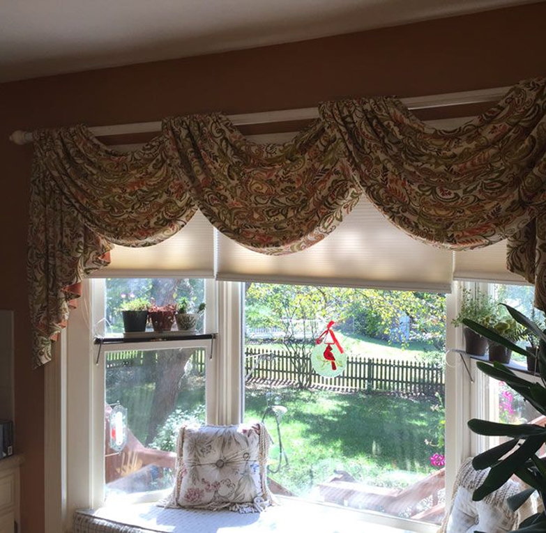Classic swag and jabots framing a bay window