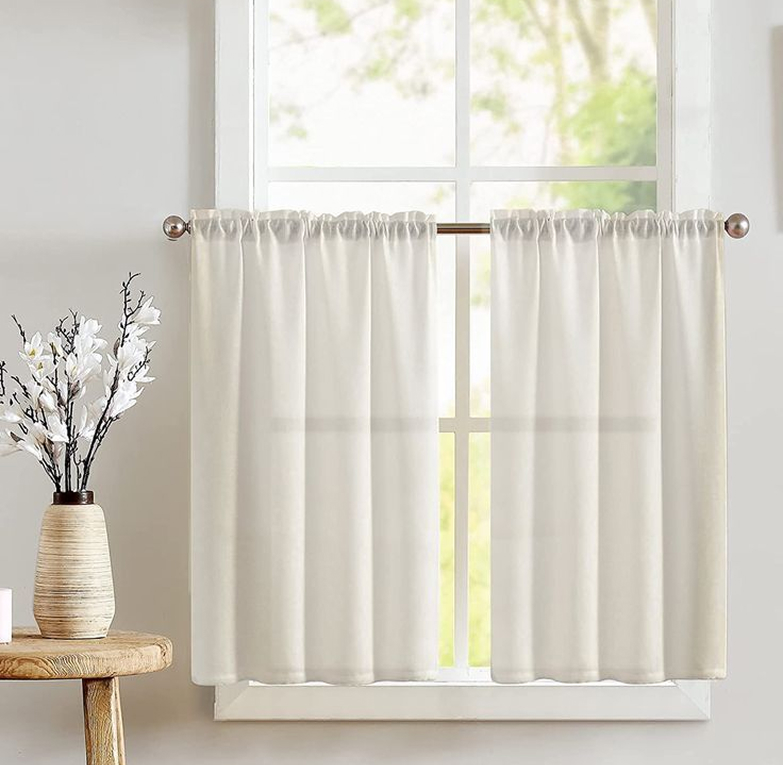 Cafe curtains in a light kitchen